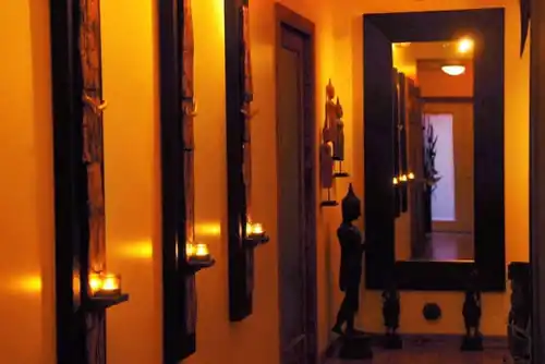 Warm candlelit hallway inside Chi Spa in Wilton Manors